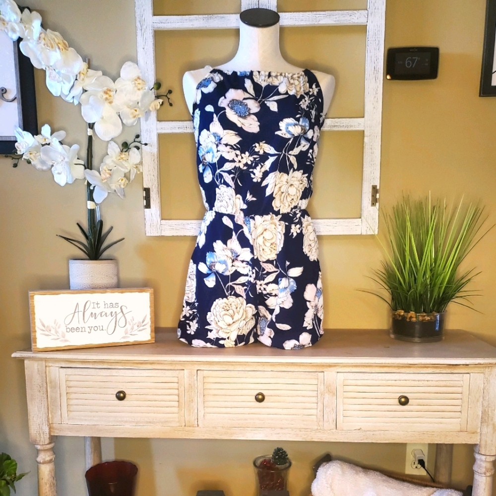 Blue and white romper with cord strings for straps